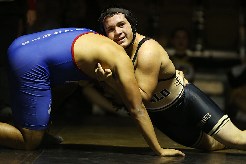 Ruben Cleveland holds down the head of Douglas opponent Ivan Diaz